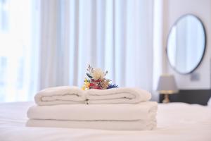 Postel nebo postele na pokoji v ubytování GALANG HOTEL