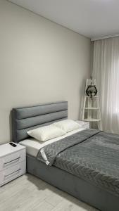 Ένα ή περισσότερα κρεβάτια σε δωμάτιο στο Central apartments