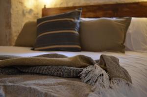 Postel nebo postele na pokoji v ubytování B&B Fuga al Trullo