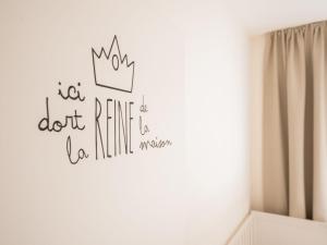 a wall sticker with a crown on a wall at Holiday Home La Gabane quiet but central house by Interhome in De Haan +21 photos