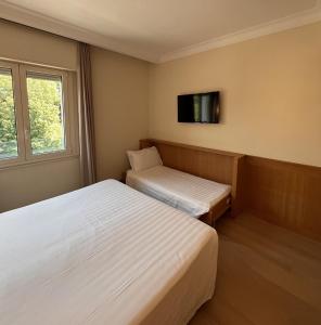 Letto o letti in una camera di Hotel Daniel & Ristorante Cocchi