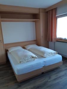 Postel nebo postele na pokoji v ubytování Pensione Valbona