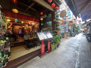 a restaurant with signs on the front of a building at Bi Saigon Hotel in Ho Chi Minh City