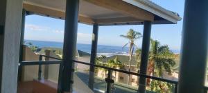a view of the ocean from the balcony of a house at Ramsgate Beachfront - Ramsgate Palms AA 50 in Margate