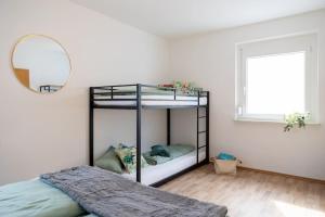 Ένα ή περισσότερα κρεβάτια σε δωμάτιο στο Heimbi-Home No 1 4-6Pers EuropaPark E Ladestation