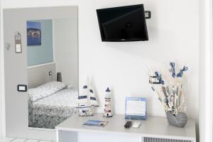 TV a/nebo společenská místnost v ubytování B&B Casa 28