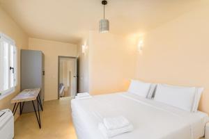 Voodi või voodid majutusasutuse Eolithos Exclusive Suites toas
