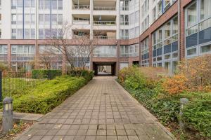 a walkway in front of a tall building at Apartmenthaus Berlin Mitte in Berlin