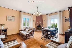 a living room with a couch and a table at Maison Ro, TerreMarine in Vezzola
