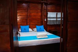 Postel nebo postele na pokoji v ubytování Ceylon Amigos Eco Resort