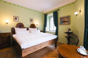 En eller flere senger på et rom på Hotel Leonardo