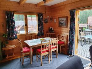 a dining room with a table and chairs at Ferienhaus Müller-Kräuter in Sankt Lambrecht