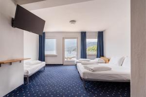 Katil atau katil-katil dalam bilik di Lake Hotel Ifigenia