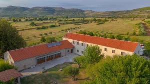 an aerial view of a building in a field at Oliane Rooms & Accommodation in Bribir