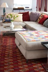 a living room with a couch and a coffee table at Munich Penthouse Rooftop Terrace in Munich