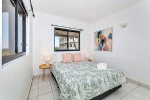 a bedroom with a bed and a window at Holiday at Harry Chan Darwin CBD Location Plus in Darwin +33 photos