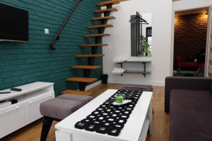 TV a/nebo společenská místnost v ubytování Apartament Elementos
