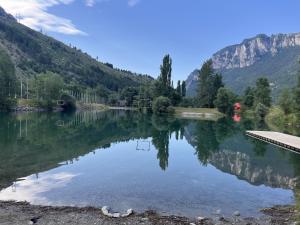 a lake in the middle of a mountain at La Taniere in Blachière