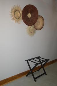 a room with three hats hanging on a wall at Uitsig Boutique Hotel in Welkom