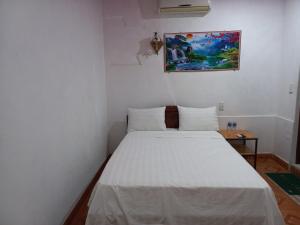 Postel nebo postele na pokoji v ubytování Homestay 117 Bà Triệu - Đồng Hới