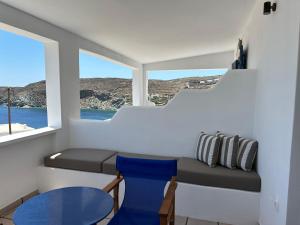 a small room with a table and a window at George Studios 1 in Kanala