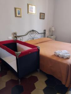 Postel nebo postele na pokoji v ubytování Bilocale per vacanze a Vada