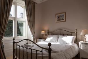 a bedroom with a bed and a window at Middleton Hall -Middleton Estate in Belford