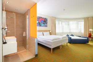 Postel nebo postele na pokoji v ubytování Hey Lou Hotel Hildesheim