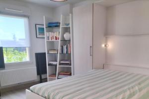 Ένα ή περισσότερα κρεβάτια σε δωμάτιο στο Charming loft near the mouth of the river Canche