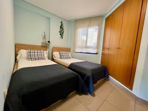 Postel nebo postele na pokoji v ubytování Blue Beach Apartment+Oceanview+Private Parking