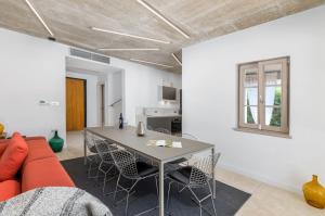 a living room with a table and a couch at Villa Calma in Šivati