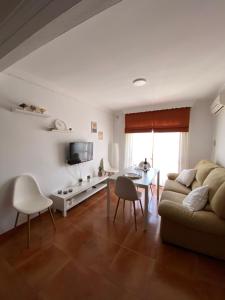 a living room with a couch and a table at Apartamento Salas in Ronda
