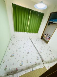 Postel nebo postele na pokoji v ubytování Vivere南5条