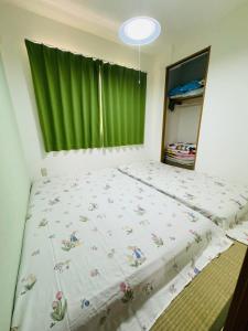 Postel nebo postele na pokoji v ubytování Vivere南5条