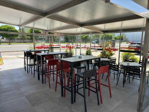 a group of tables and chairs in a restaurant at Hostal Restaurante Iruñako in Burgos
