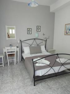 Postel nebo postele na pokoji v ubytování Alexandra Studios