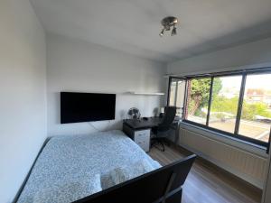 Ένα ή περισσότερα κρεβάτια σε δωμάτιο στο Rooms for Tomorrowland 2025