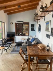 a living room with a couch and a table at Karigador beach house in Karigador