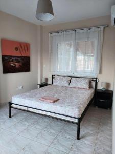 Ένα ή περισσότερα κρεβάτια σε δωμάτιο στο Gabi's Apartment