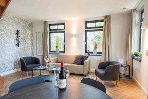 Posezení v ubytování Hof Molenerve - gastenkamers en vakantiewoning