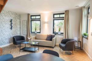 Posezení v ubytování Hof Molenerve - gastenkamers en vakantiewoning