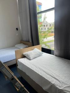 Ένα ή περισσότερα κρεβάτια σε δωμάτιο στο THH Apartments