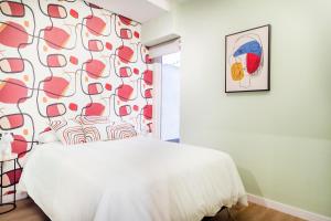 Ένα ή περισσότερα κρεβάτια σε δωμάτιο στο Apartamento B Cube by Mimood Aparthotels