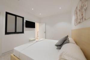 Postel nebo postele na pokoji v ubytování ViVi Aparthotel