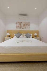 Postel nebo postele na pokoji v ubytování ViVi Aparthotel