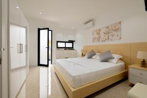 Postel nebo postele na pokoji v ubytování ViVi Aparthotel