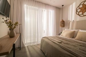 Televízia a/alebo spoločenská miestnosť v ubytovaní Cossoro Villas Zakynthos
