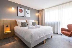 Sevenline Purpan Toulouse客房内的一张或多张床位