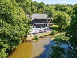 an aerial view of a building next to a river at 1 Valley View in Looe