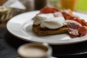 a white plate with food on a table at The Mill Bed and Breakfast in Stone